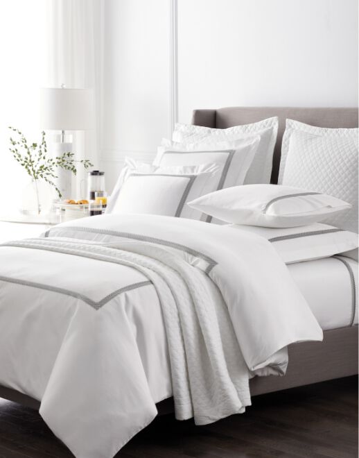 White Hotel-Style Bed with Folded Duvet