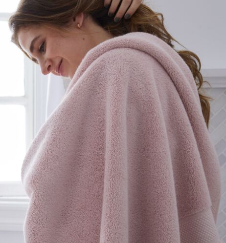 Woman wrapped in pink towel