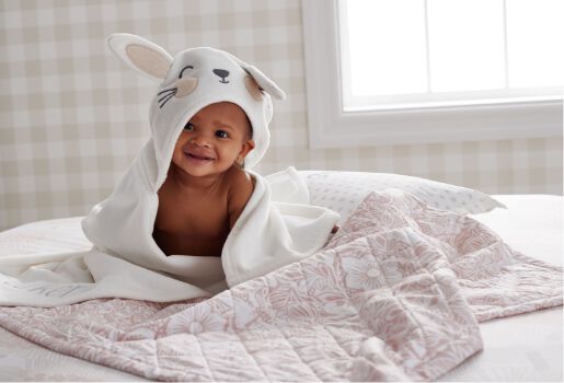 baby wearing hooded bath robe