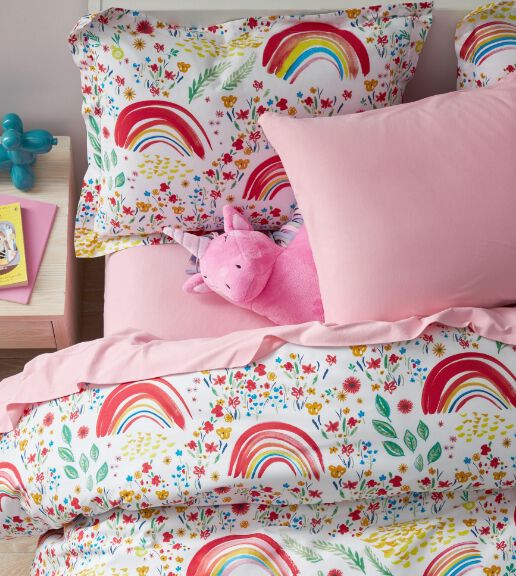 bed with rainbow bedding