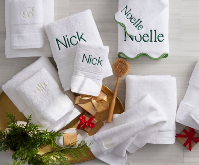 Image of white towels with green embroidered personalization Image of white towels with green embroidered personalization