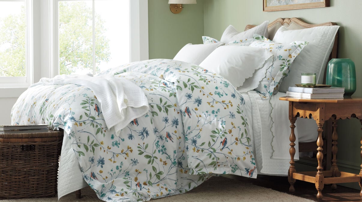 Image of bed made with floral duvet cover Image of bed made with floral duvet cover