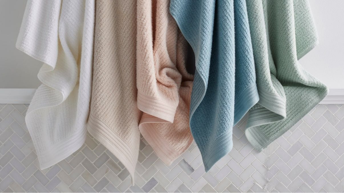 image of colorful towels hanging on wall image of colorful towels hanging on wall