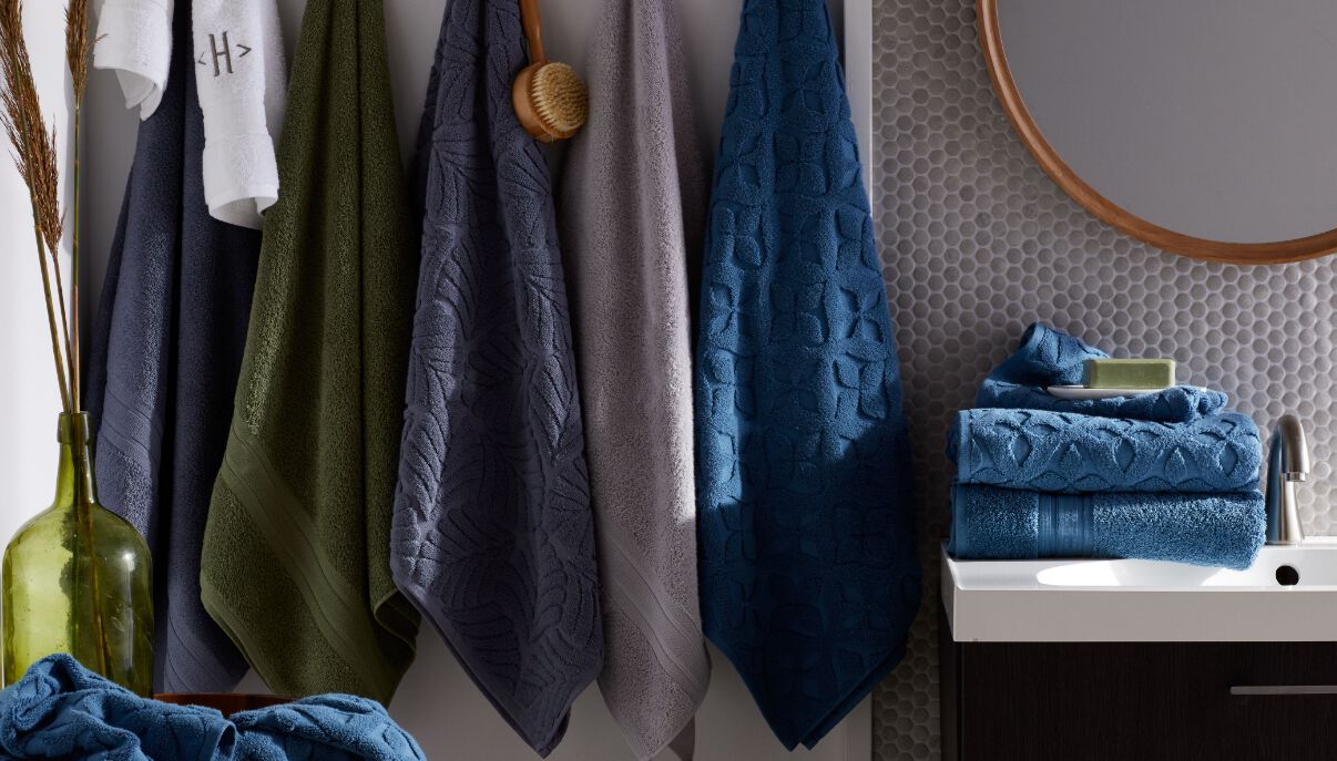 Blue, green and gray towels hanging