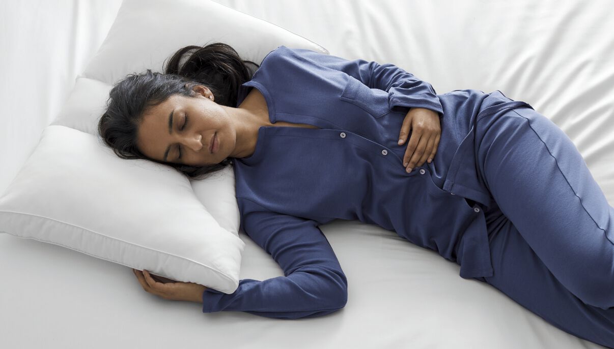 Person sleeping on back with specialty pillow