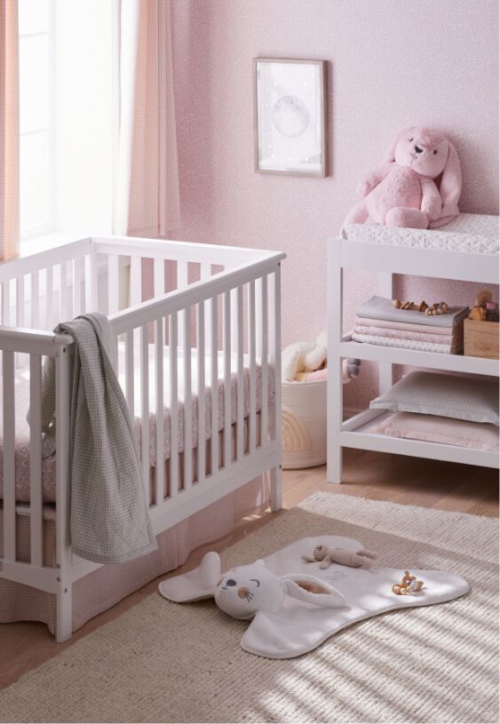 Image of baby nursery with pink and white decor