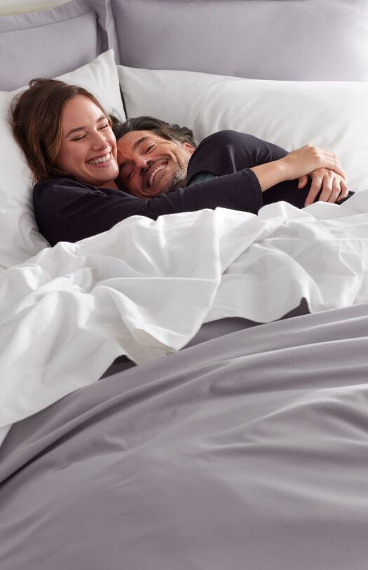 Couple Snuggling in Bed