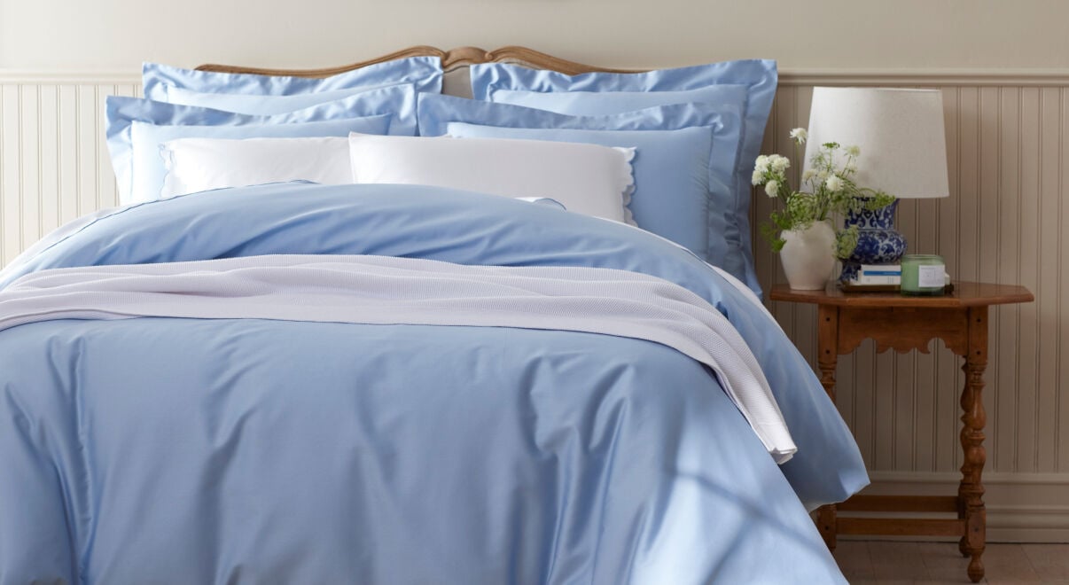 Image of bed in cool blue bedding