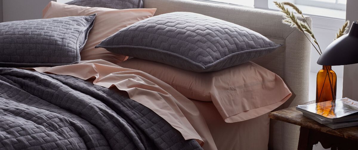 Image of Bed with Gray High-Quality Quilt